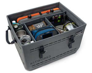 Gray camping storage box with various camping items inside, branded 'Kitworks'.