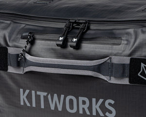 Gray bag with 'KITWORKS' branding and black zippers