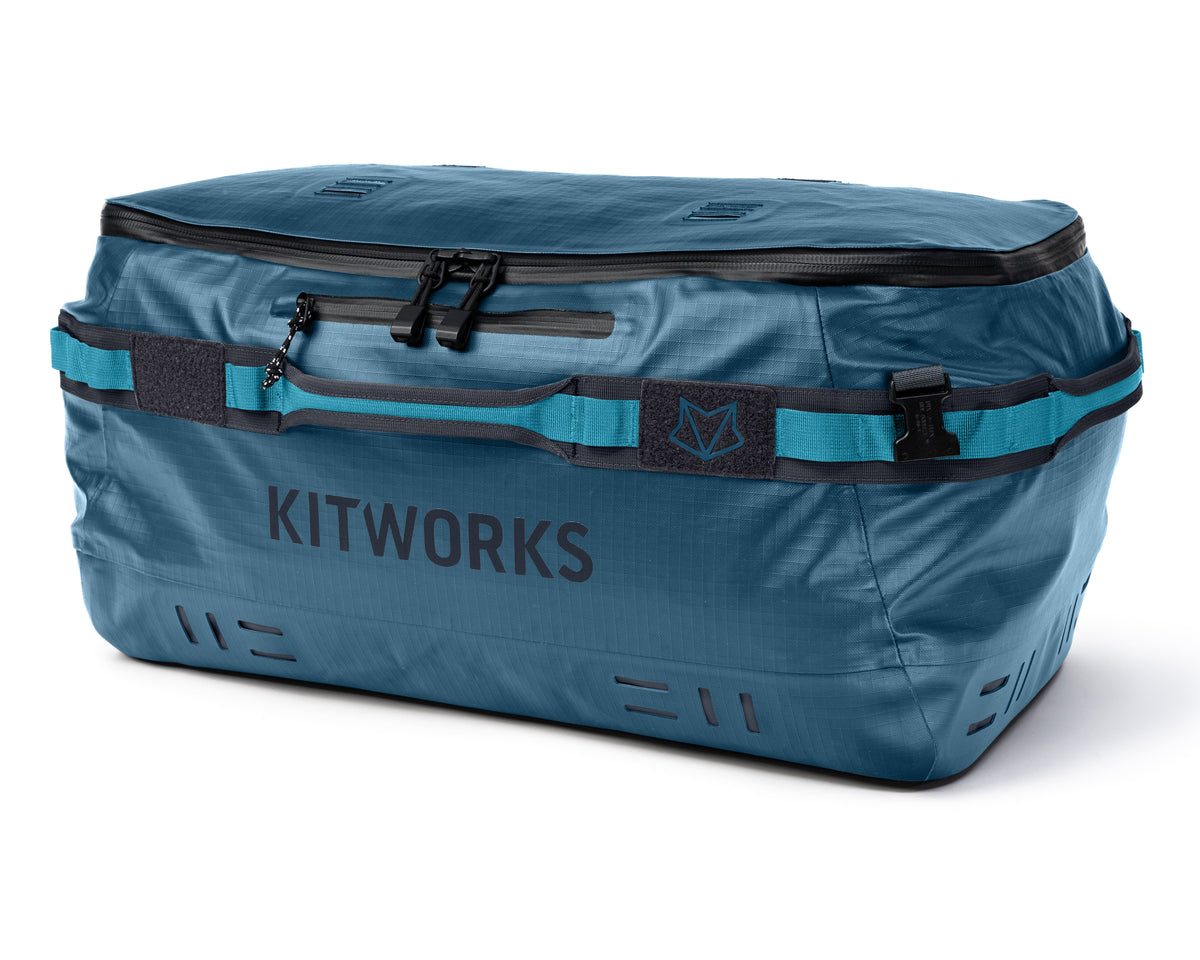 Blue duffel bag with 'KITWORKS' branding on a white background
