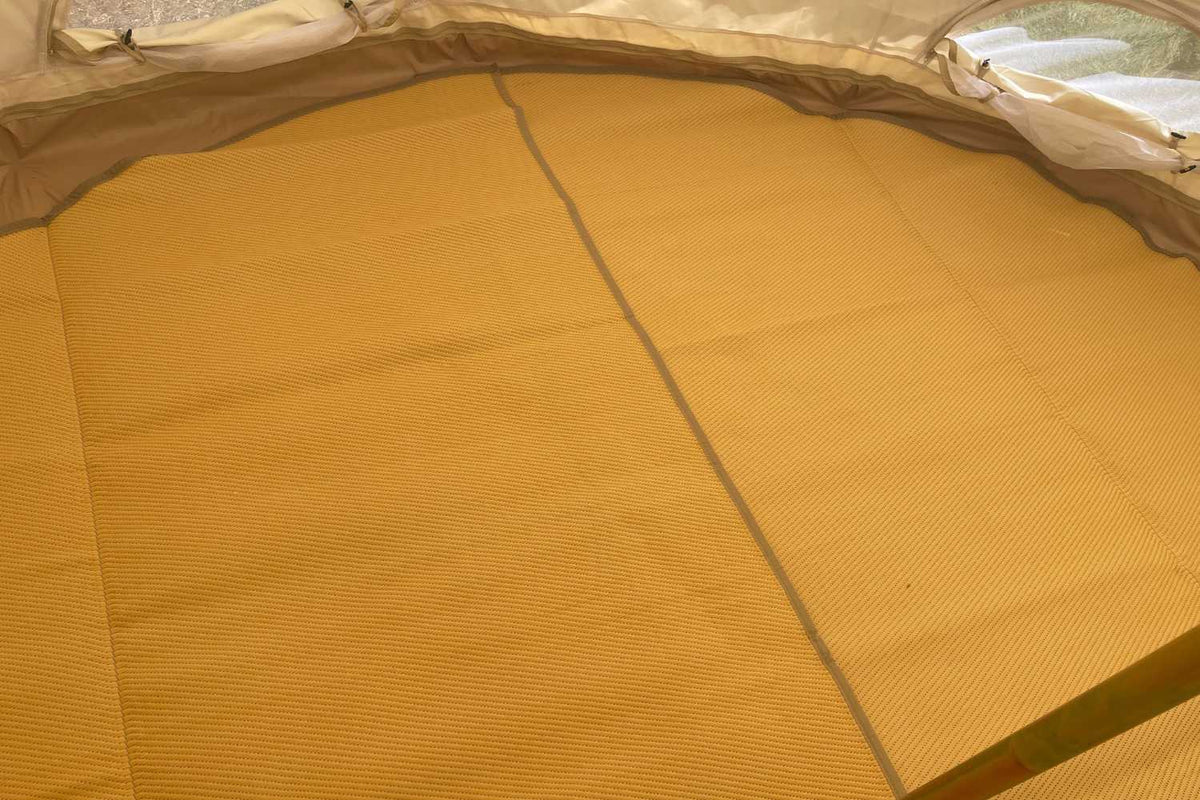 overlapping round rug on bell tent floor