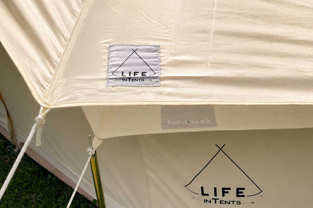 Close-up of a fly cover tent with 'LIFE INTENTS' branding