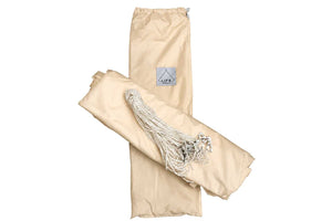 Beige bell tent bag with ropes and a bard label on a white background