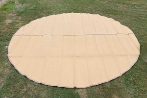 tan bell tent rug on grass