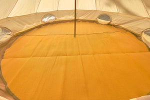 tan rug inside bell tent