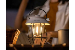 white  camping lantern at night