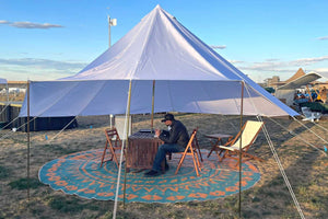 popup shade tend with person sitting in it