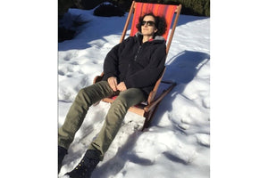 person in snow on a byer of maine chair
