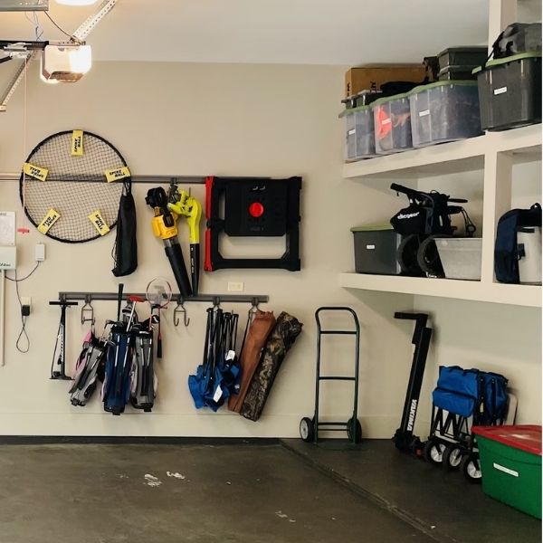 organized garage with shelves of camping gear