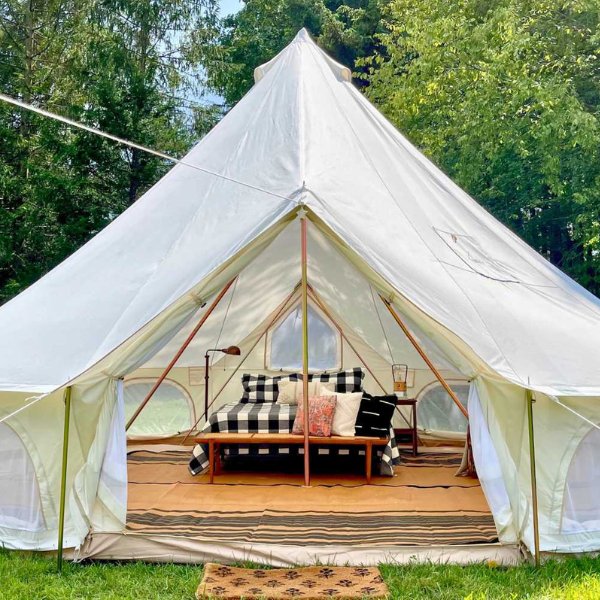 decorated canvas tent with open door in the outdoors