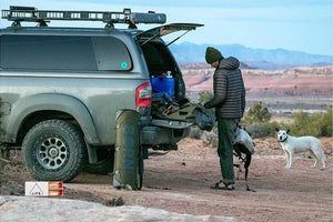 man and dog with a overlanding truck