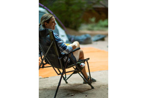 woman in camping chair camping  
