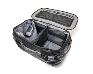 Open travel bag with compartments on a white background