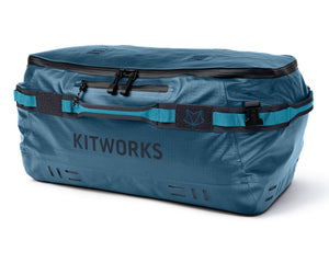 Blue duffel bag with 'KITWORKS' branding on a white background