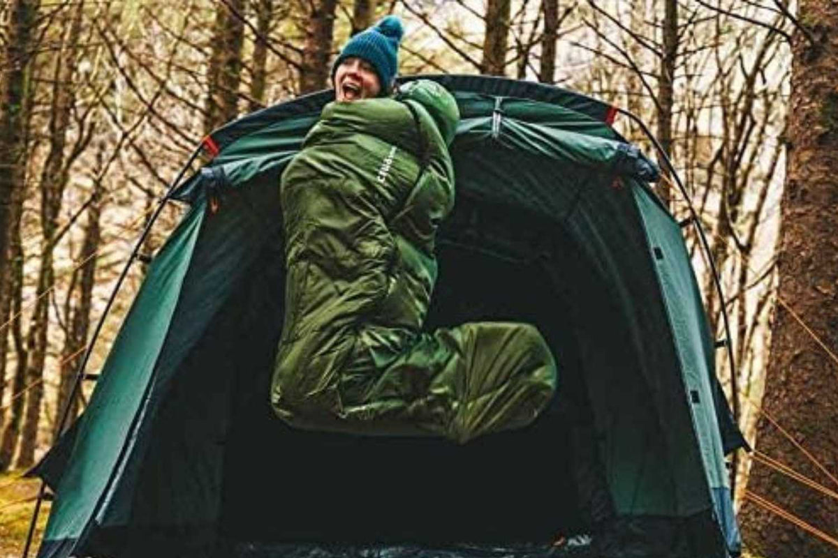 woman jumping in sleeping bag
