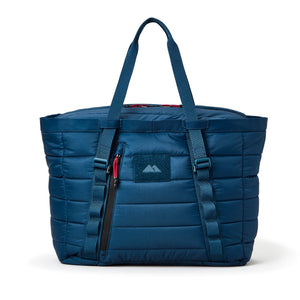 Blue quilted tote cooler with a visible brand logo on a white background