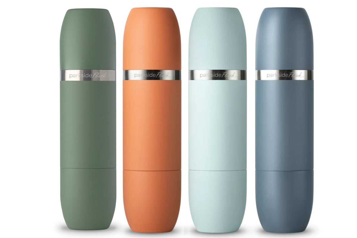 Four parkside 700 personal wine flasks in matte sage green, terracotta orange, pale mint, and slate blue, arranged in a row against a white background.