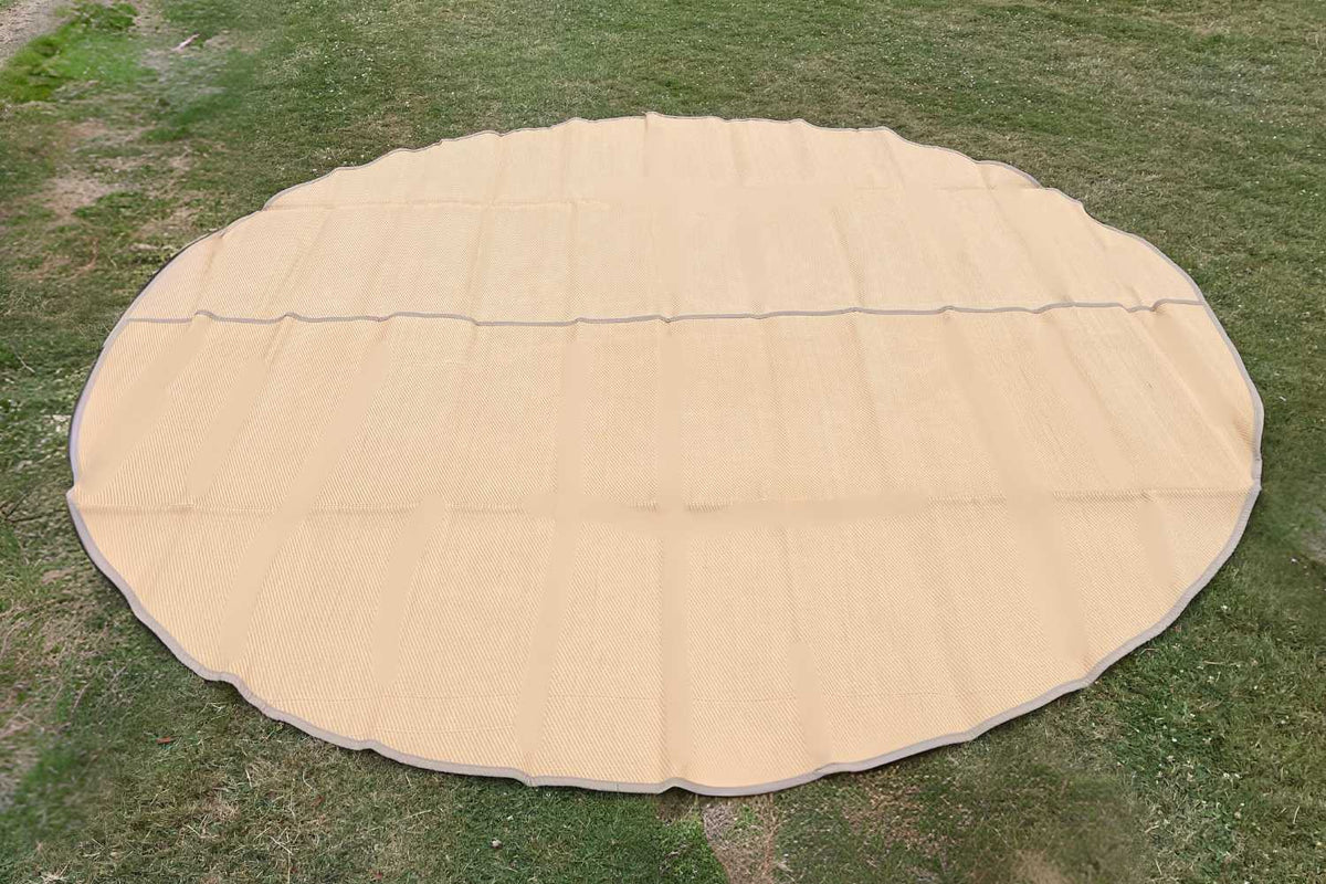tan bell tent rug on grass