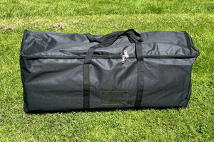 black rug bag on grass