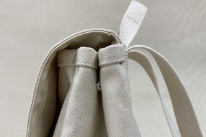 snap on side of backpack