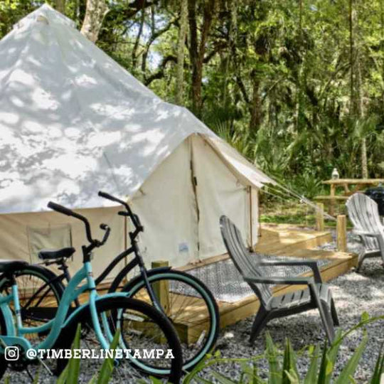 canvas tent with bike in front