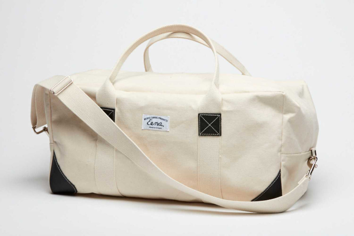 strap on duffel bag white background