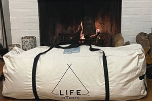 tent duffle bag in front of fireplace