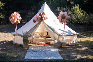 glamping tent with balloon outside