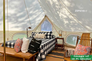 inside of of bell tent showing a bed and chair