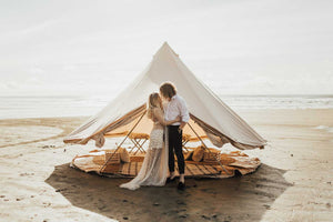 glamping tent on beach with couple