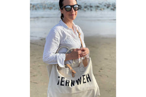 fernweh beach bag on woman