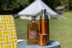 flask in front of glamping tent