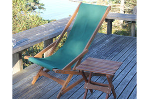 green chair on deck with table
