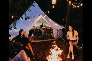 bell tent with people at night