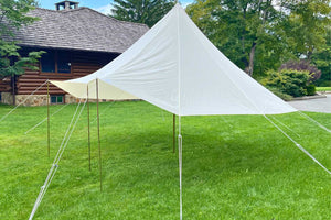 side of sun and rain shelter tent outdoors