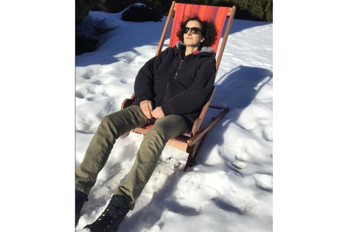 person in snow on a byer of maine chair