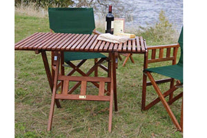 camping table by lake with wine